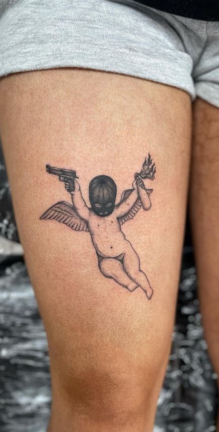 Mens Cherub Tattoo, Cherub Wings Tattoo, Womens Angel Tattoos, Bad Cherub Tattoo, Angel With Tattoos Tattoo, Cupid Tattoo Ideas, Angel Tattoo On Thigh, Angelic Tattoo Designs, Creepy Angel Tattoo