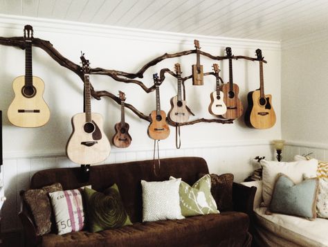 We planted ourselves a little guitar tree and this is our first years harvest! Hoping for larger crop next year, maybe the uke buds will grow into an Olson, Ryan, Santa Cruz , but even a Taylor would be nice! My husband is an amazing artist! I asked for a creative guitar hanger and this is what he came up with. Guitar Storage, Home Music Rooms, Guitar Display, Rama Seca, Guitar Room, Guitar Stands, Guitar Hanger, Budget Design, Deco Studio