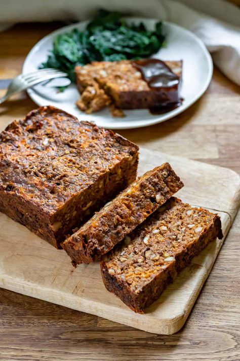 This easy Nut Roast is a delicious and hearty vegetarian or vegan main to serve at your next holiday gathering! The lentil and nut loaf is a meat-free meatloaf that's full of flavors and textures. You'll love serving it sliced with gravy. Vegetarian Christmas Appetizers, Vegetarian Nut Roast, Lentil Loaf Vegan, Lentil Loaf Recipe, Vegan Nut Roast, Roasted Nuts Recipe, Veggie Desserts, Nut Roast, Vegetarian Party Food