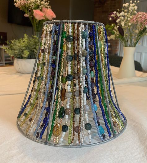 Each lampshade is meticulously hand beaded by yours truly :) Made with great care and attention to detail, this lampshade will be a unique addition to any room in your home or office! This lampshade includes Indian and marine agate gemstones, strung on sturdy beading wire! It also features glass beads to compliment the gemstones, the colors featured are in shades of blue, green, gold and white. This lampshade took me over a month to make! It can take days or weeks to source the perfect lampshade Colored Wire Crafts, Beaded Lampshade Diy, Beaded Lamp Shade, Witchy Bedroom, Beaded Lampshade, Beaded Lamps, Lampshade Makeover, Diy Lampe, Saratoga Springs Ny