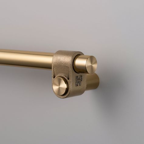 This Cast Cabinet Pull features a solid construction that is expertly finished and showcases a distinctive rough-cast knuckle and meticulously hand-polished solid metal bar. The casting process ensures each knuckle is uniquely formed, making every piece one-of-a-kind. It is suitable for a variety of interior spaces, including bathrooms. Hand tighten with a screwdriver. Power tools may strip the screws. Clean only with mild dish soap diluted in warm water. Cleaning chemicals may damage the finish Hardware Tape, Shower Door Handles, Furniture Hinges, Buster Punch, Cabinet Detailing, Brass Detail, Pull Bar, Cookbook Holder, Cabinet Latch