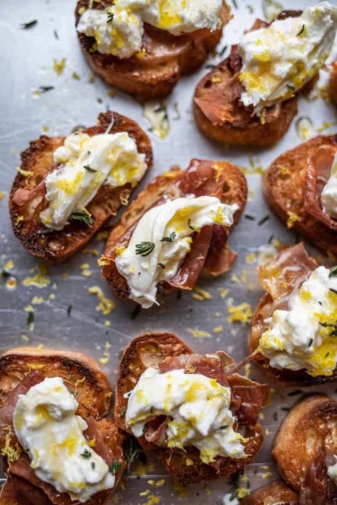 Burrata Crostini With Prosciutto - Female Foodie Burrata Crostini, Female Foodie, Microplane Zester, Baguette Slices, Crostini Recipes, Basting Brush, Popular Side Dishes, Prosciutto Crudo, Sliced Baguette