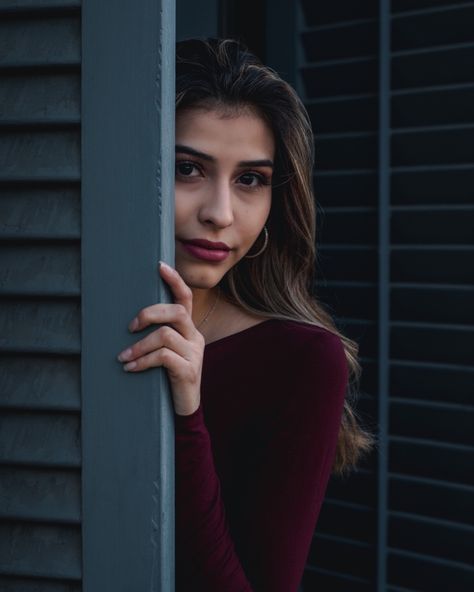 Mysterious looking girl wearing a red top hiding behind a blue wooden door Hiding Reference, Door Poses, Sketchbook Inspo, School Paper, Hidden Door, Red Top, Girls Wear, Art Stuff, Zombie