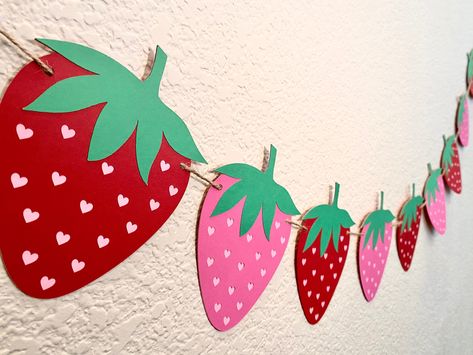 "Introducing our delightful Strawberry Birthday Banner, the perfect addition to your little one's special day!  Whether you're celebrating a \"Sweet One\" turning one or a \"Two Sweet\" birthday milestone, this garland is the ideal decoration to set the tone for a berry-licious party. The Strawberry Birthday Banner adds a touch of whimsy and excitement to any venue, making it perfect for indoor and outdoor festivities alike. Make your little one's birthday truly unforgettable with the Strawberry Strawberry Balloon Decor, Strawberry Ideas Decoration, Strawberries Decorations Ideas, Two Sweet Party 2nd Birthday Strawberry, Diy Strawberry Birthday Decor, Strawberry Diy Decor, Strawberry Shortcake Decor, Diy Strawberry Decorations, One Strawberry Birthday