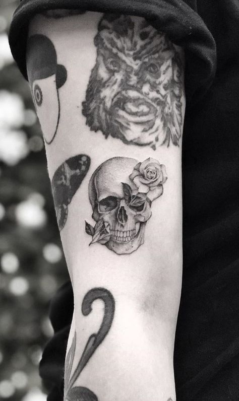 Skull & Rose Tattoo - TattManiaTattMania Sideways Skull Tattoo, Small Skull With Rose Tattoo, Small Skull And Rose Tattoo, Skull And Black Rose Tattoo, Skull With Rose In Mouth Tattoo, Small Skull Hand Tattoo, Cute Skull Tattoos Small, Small Skull Tattoo Ideas, Skull Tattoo Placement