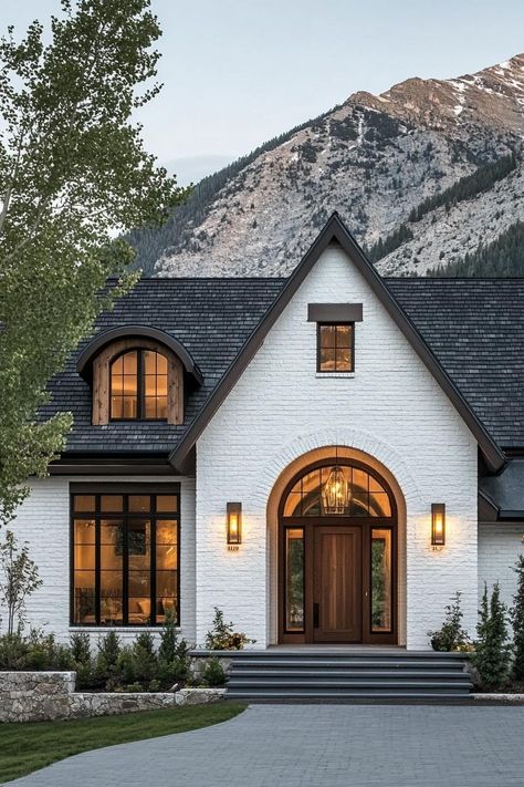 Cream House Exterior Black Trim, Tan House Black Roof, Mountain Home Entryway, House With Brown Windows, White House With Brown Trim, Modern House Mountain, Homes With Black Windows Exterior, Modern Cottage House Exterior, White Brick House Black Trim