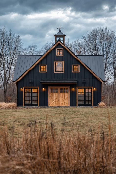 40 Amazing Converted Barn Homes That Once Were Old Barns Black Barndo With Wood Trim, Barndo Farmhouse Plans, Farm House Ideas Architecture, 3 Story Barndominium, Black House Copper Roof, Dark Farmhouse Interior, Barn Exterior Colors, Metal Barns Exterior, Barndo Exterior Colors