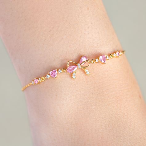 Tie your style together with our Little Bow Peep Bracelet– a sweet and chic accessory that's the 'knot'-ty solution to your fashion needs! This bracelet features a dainty pink bow, adding a touch of playful elegance to any outfit. This bracelet is the perfect way to add a 'bow-tiful' finishing touch to your look! Pink Butterfly Bracelet, Big And Little Sorority Gifts, Gold Bow Jewelry, Coquette Charm Bracelet, Things To Add To Your Wishlist, Gold And Pink Jewelry, Cute Pink Accessories, Cute Pink Things, A Lot Of Bracelets