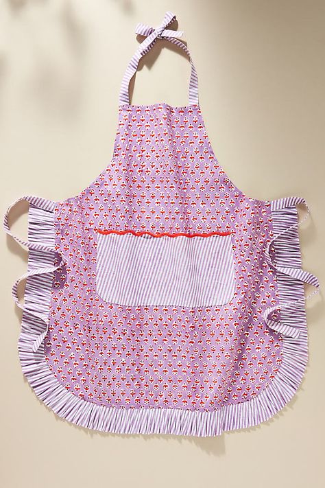 Chic and timeless, this lovely handmade blockprint apron elevates the everyday and adds a colorful charm to your kitchen. The charming color combo and the striped trim make a bold statement. | Henney Apron by Furbish Studio in Purple, Cotton at Anthropologie Cute Baking Apron, Colorful Apron, Cute Apron, Furbish Studio, Apron Pattern, Christmas Gifting, Apron Sewing Pattern, 2024 Ideas, Outdoor Gifts