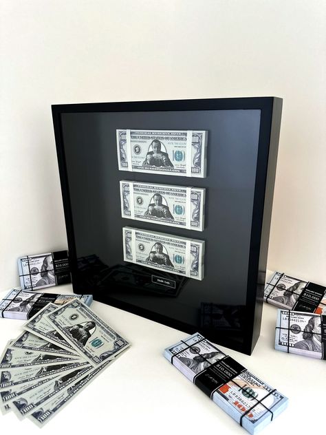 Three stacks of 100 dollar bills featuring the Wolf of Wall Street framed in real wood and real glass. The frame is made of natural wood in our store. The frame is painted with black paint and varnish. The glass installed is real. The glass installed is real. Frame size approximately 35x35cm. Thickness 5.5 cm. It can be 2-3 mm thick. We do not use films or glass substitutes. Everything we do is high quality and natural. Packs of money are raised, creating a levitation effect. All packs consist o Neon Tiger, The Wolf Of Wall Street, Boys Bedroom Makeover, Stylish Wall Decor, Money Stacks, Future Apartment Decor, Wolf Of Wall Street, Dollar Bills, 100 Dollar