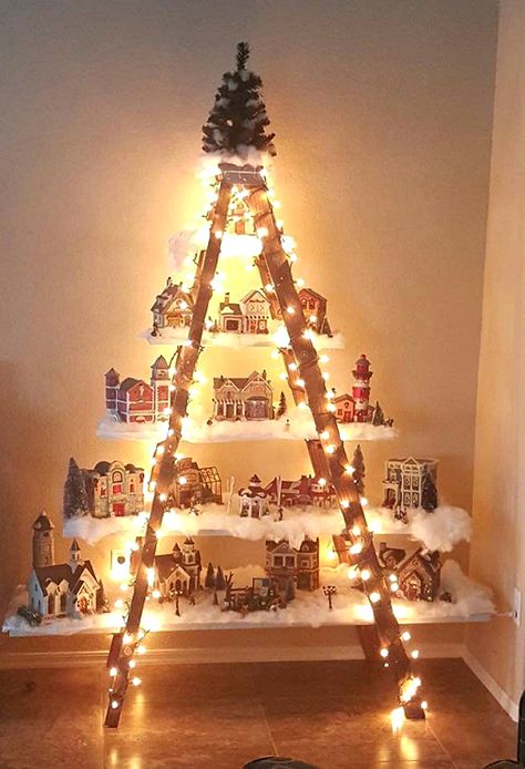 Here’s a lovely idea to do if you have an old ladder in the garage! Make a beautiful Christmas village with lights and houses! This was made by Lydia Mendoza. She says “I had an old ladder from a yard sale. I put planks of wood that I painted white on the steps to form … Ladder Christmas Tree, Christmas Ladder, Christmas Tree Village, Old Ladder, Christmas Village Display, Diy Christmas Decorations Easy, Easy Christmas Diy, Christmas Villages, The Garage