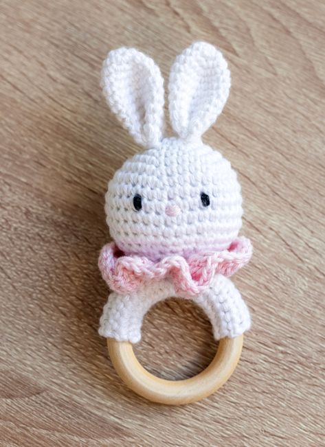 This post features a free crochet amigurumi pattern for a cute bunny teether. Follow along with the photo tutorial to learn how to do it. Crochet Baby Rattles Free Pattern Toys, Bunny Crochet Pattern Free, Crochet Rabbit Free Pattern, Crochet Elements, Knitting Sweaters Diy, Teether Pattern, Bunny Teether, Baby Amigurumi, Crochet Products