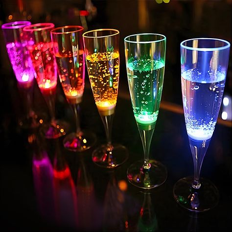 PRICES MAY VARY. 【5 Single Colors + 1 Rainbow】-A set of 6 champagne flutes including 5 single light cups which are red, yellow, blue, green, pink, and 1 rainbow which has 7 rainbow colors alternately Transformation. Colorful glowing cups will bring you the ultimate visual feast 【Liquid Activated, No Assembly Required】-Champagne glasses will be light up when any liquid in, and the light will be turned off when the liquid was poured out. Each LED light, which is powered by the battery at the botto Party Favors Adults, Glow Party Favors, Glowing Glasses, Halloween Weddings, Led Party Lights, Champagne Drinks, Plastic Champagne Flutes, Champagne Flute Set, Future Wedding Plans