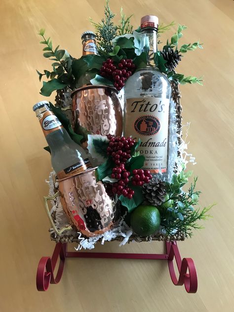 Moscow Mules for Christmas! Tito’s vodka, ginger beer, and lime. Add a splash of cranberry and a few frozen cranberries for a holiday twist! Vodka Christmas Gifts, Alcohol Christmas Basket, Tito’s Vodka Gift Basket, Christmas Booze Basket, Liquor Basket Ideas Christmas, Tito’s Gift Basket, Tequila Christmas Gift Ideas, Neighbor Christmas Gifts Alcohol, Booze Basket Ideas Christmas