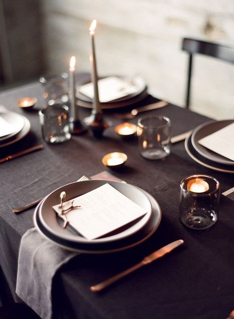 This is the great example of sticking to an overall dark color palette. We love how the gray table and glassware looks against back votive holders and black linens. Black Tablecloth Wedding, Black Wedding Table, Pillar Candles Wedding, Wedding Candles Table, Black Wedding Decorations, Black Tablecloth, Grey Table, Simple Photo, Black Table