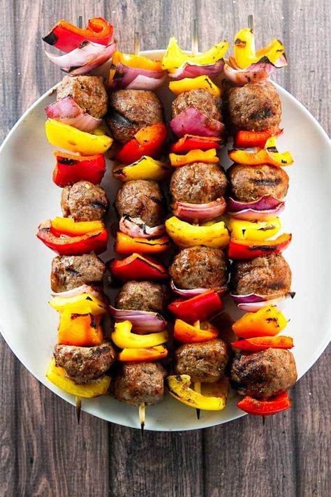 Grilled Italian Beef Skewers with fresh bell peppers, red onion, and homemade meatballs. The meatballs are brushed with a simple tomato glaze that takes about two minutes to mix-up! This is the best kind of summer comfort food. Pop over to my site for the recipe! | dinner ideas | ground beef recipes | summer recipes | Healthy Sunday Dinner Ideas, Sunday Dinner Ideas Families, Meatballs Beef, Meatball Skewers, Juicy Meatballs, Sunday Dinner Ideas, Kabob Skewers, Beef Skewers, Kabob Recipes