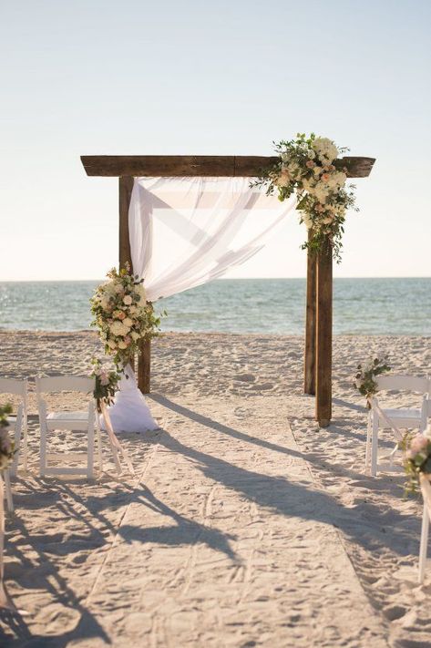 Pretty Pink Beach Wedding With An Elegant, Formal Reception | Stephanie A Smith Photography | Carolina Herrera Wedding Dress | wooden alter with blush roses, peonies, eucalyptus & draped fabric Wooden Alter, Carolina Herrera Wedding, Pink Beach Wedding, Carolina Herrera Wedding Dress, Beach Wedding Pink, Beach Wedding Decorations Reception, Dream Beach Wedding, Roses Peonies, Beach Wedding Inspiration