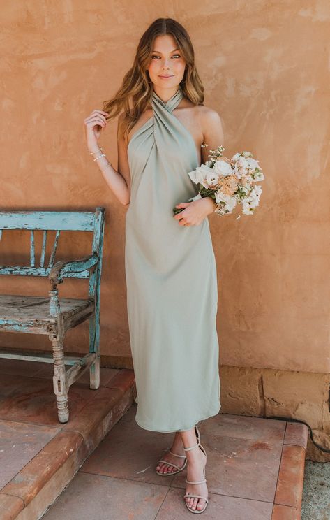 Our best selling halter maxi is now in midi length! This midi is cut on the bias to give that perfect slip draping we're all looking for. The top softly wraps around your neck for a flattering high neck and leaves a dramatic open back. Beyond chic for a bridal party and a new go-to for special occasions and events! Beach Theme Bridesmaid Dresses, Bridesmaid Dress Colors Summer, Moss Bridesmaid Dress, Metallic Bridesmaid Dresses, Maternity Dress Wedding Guest, Garden Wedding Dress Guest, Olive Green Bridesmaid Dresses, Mismatched Dresses, Pastel Bridesmaids