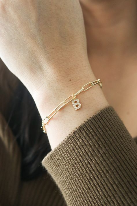 Beautiful bracelet with Initials. This bracelet, your wrist will seriously love! This pearl bracelet is so simple, but super elegant. Makes a great gift! Perfect on it's own or stacked with more bracelets! ----------------------♡--------------------- M A T E R I A L S: * Chain :18K Gold Plated over Brass * Cubic Zirconia -----------------------♡-------------------- SIZE * Chain length: adjustable from 6 to 8 INCHES -----------------------♡-------------------- H O W T O O R D E R 1.) Choose the O Bracelet With Letters Gold, Bracelet With Initials, Initial Bracelets, Cotton Cord Bracelet, Gold Bracelets Stacked, Gold Bracelet Simple, Elegant Jacket, Antique Jewellery Designs, Modern Bracelets