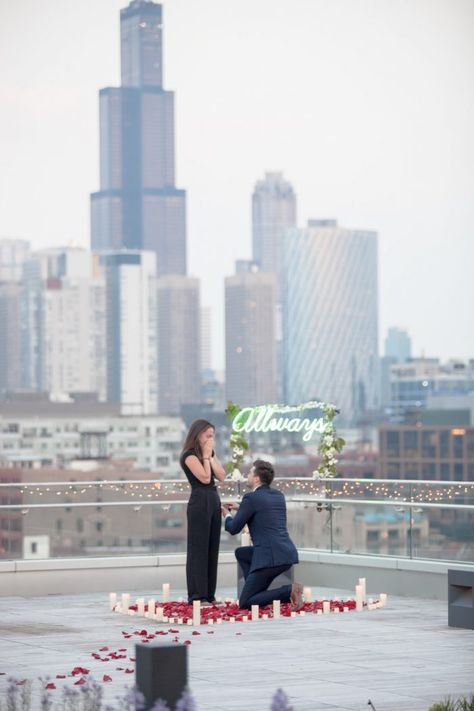 He proposed on a Chicago rooftop with the Chicago skyline in the back! Read more on How They Asked! #howtheyasked #chicago #chicagoskyline #chicagoproposal #engagement #engaged #engagementideas #cityengagement #howtopropose #weddinginspo #proposalinspo #dreamproposal #summer Proposal Ideas City, Proposal Ideas Chicago, Chicago Proposal Ideas, Candlelit Proposal, Proposal Tips, Chicago Photoshoot, Rooftop Proposal, Chicago Proposal, Outdoor Proposal