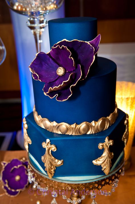 Royal blue, gold, purple cake Purple Blue Gold Party Decorations, Blue Gold And Purple Wedding, Purple Blue Gold Birthday Party, Royal Blue And Purple Wedding Cake, Royal Blue Purple And Gold Wedding, Royal Purple Wedding Decorations, Purple Blue Gold Wedding, Purple And Blue Quinceanera Ideas, Royal Blue And Purple Wedding Theme