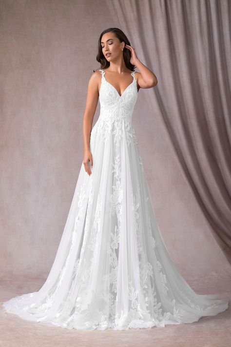 Bohemian meets luxe in our stunning Delaina wedding gown. She features a gorgeous plunging V-neckline with delicate hand pleats on the bodice. Exquisite floral and leafy lace appliqués are placed all along the bodice, trailing over the shoulder straps. The look is complete with a full A-line skirt and a cathedral length train for a truly whimsical feel. Wedding Dresses Diamonds, Plus Zise, Wedding Dress Flowy, Wedding Wonderland, 2022 Wedding, Wedding Dress Train, Dream Wedding Ideas Dresses, A Wedding Dress, Perfect Wedding Dress