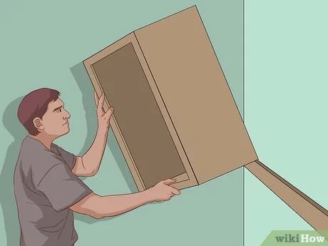 How To Hang Upper Kitchen Cabinets, Mounting Cabinet To Wall, How To Install Wall Cabinets, How To Hang A Cabinet On A Wall, How To Mount Cabinets On Wall, How To Hang Wall Cabinets, How To Hang Cabinets Laundry Rooms, Hanging Cabinets Kitchen, How To Hang Kitchen Cabinets