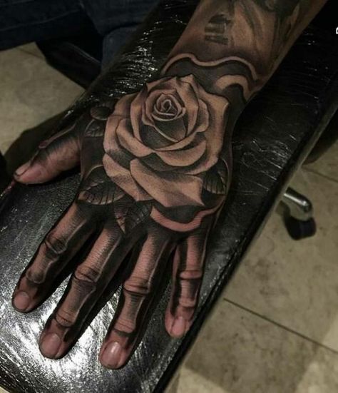 Rose on skeleton hand Skull Finger Tattoos, Bone Hand Tattoo, Tato 3d, Tattoo Main, Herren Hand Tattoos, Skull Rose Tattoos, Skull Hand Tattoo, Rose Hand Tattoo, Rose Tattoos For Men