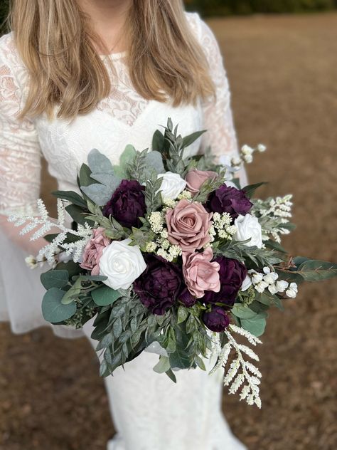 These STUNNING arrangements are made from high quality silk and foam flowers. Get the look of real flowers without the astronomical price!  There are wrapped very thoroughly with floral tape and ribbon.  Production time is 2 weeks, one week for shipping. I do offer rush options for smaller orders  Instructions on freshening up your bouquets after shipment:  https://youtu.be/pLwjPo7JvpA Simple Purple Wedding Bouquets, Purple And Eucalyptus Bouquet, Plum Beach Wedding, Plum And Mauve Bouquet, Dark Mauve And Sage Green Wedding, Plum And Pink Wedding Flowers, Plum Purple Bouquet, Plum Wedding Flowers Bride Bouquets, Plum And Green Wedding Colors