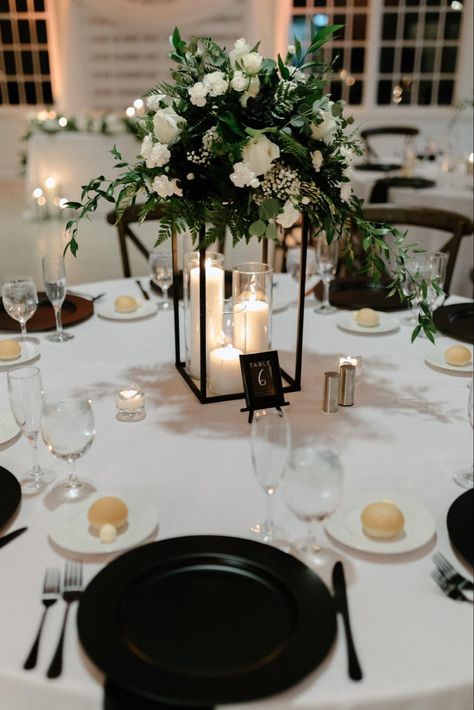 Black White And Gold Flower Centerpiece, Black And White Wedding Theme Centerpieces, Sage Green And Black Centerpieces, Round Table Centerpieces Wedding Elegant Candle Holders, December Wedding Flowers Centerpieces, Black And White Eucalyptus Wedding, Black Harlow Stand Centerpiece, Black And Ivory Wedding Centerpieces, All Black Wedding Centerpieces