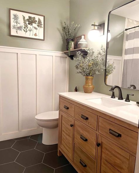 A fan favorite for bathrooms is a black hexagon tile with gray grout, especially in modern bathrooms. They look particularly upscale and trendy beside a board and batten wall and an updated vanity cabinet. These tiles can be made in other colors, but the matte black finish is very chic, especially when worked in with wooden accent pieces...   Image: thebradfordhouse Kitchen Islands With Seating, Islands With Seating, Spare Bathroom, Full Bathroom Remodel, Bathroom Accent Wall, Black Home Decor, Farmhouse Flooring, Tiles Floor, Freestanding Kitchen