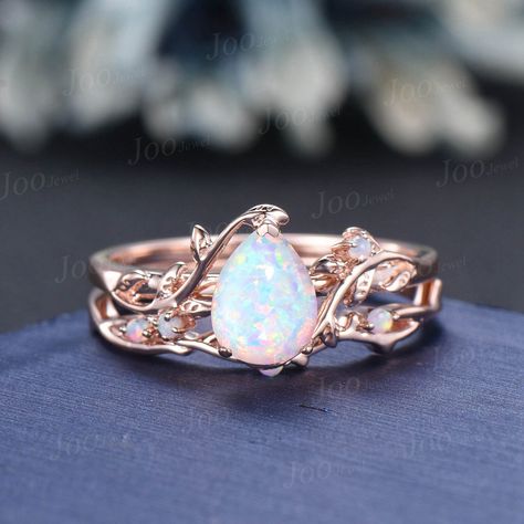 Nature Inspired  Jewelry, Twig Opal Ring Set , 10K Rose Gold, Hexagon Cut Ring, Branch Engagement Ring, opal Wedding Ring , October Birthstone, Birthday Gifts Main Ring : 6*8mm pear cut Lab white opal. Side stone : lab created opal Matching Band: lab created opal Material Metal: 925 sterling silver, Solid 14k/18k gold, platinum PLEASE choose silver or platinum if you are allergic to nickel. This jewelry is made to order, it can be made with any gemstone/metals. 2-3 weeks to finish. Default Shipp Pear Cut Opal Ring, Wedding Ring Opal, Birthstone Wedding Ring, Opal Engagement Ring Rose Gold, Opal Wedding Ring, Cute Promise Rings, Branch Engagement Ring, Pink Opal Ring, Heart Wedding Rings