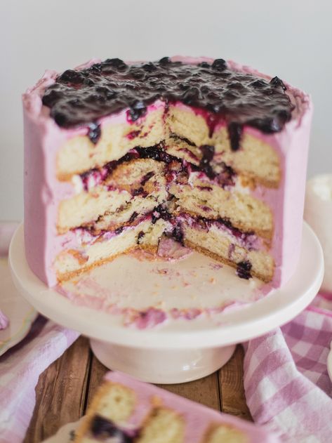 Blueberry Delight Cake - Nilla wafer crust, lemon ricotta cake layers, ricotta filling, blueberry compote and blueberry buttercream. #cakebycourtney #cake #blueberrydelightcake #stackingcakes #caketutorial #cakedecoratingtutorial #blueberry #summercake #summerdessert #blueberrydessert Dairy Free Lemon Cake, Blueberry Cream Cheese Frosting, Lemon Blueberry Layer Cake, Blueberry Layer Cake, Blueberry Buttercream, Cake By Courtney, Fluffy Layers, Lemon Ricotta Cake, Blueberry Delight