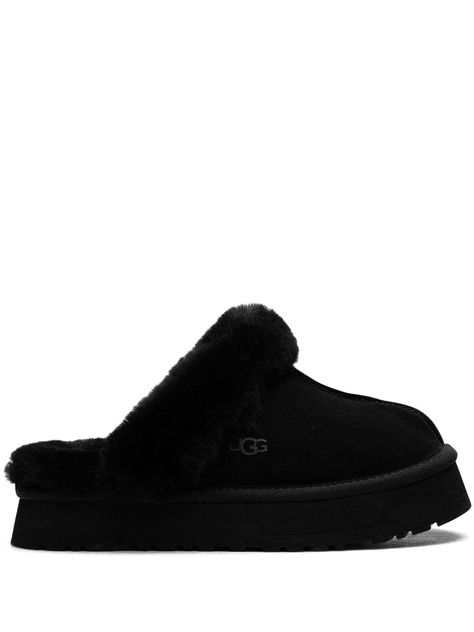 black suede shearling trim debossed logo to the side round toe slip-on style shearling lining EVA midsole flatform sole We've partnered with Good On You — an independent agency that rates how brands perform in relation to their impact on the planet, people and animals, with a multi-criteria rating simplified to a five points scale. In order to be awarded our conscious label, larger brands need to score a minimum of four out of five ('Good'), while smaller brands must score at least three out of Black Slippers Aesthetic, Black Uggs Slippers, Black Ugg Slippers Outfit, Black Slippers Outfit, Y2k Slippers, Black Ugg Slippers, Cute Uggs, Nb Shoes, Trendy Slippers