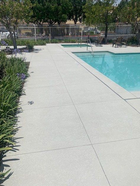 Pool Deck - Decorative Concrete Surfaces Decorative Concrete Pool Deck, Honed Concrete Pool, Pool Deck Concrete Ideas, Pool Concrete Deck Ideas, Concrete Around Pool Ideas, Concrete Pool Coping, Concrete Pool Deck Ideas, Stamped Concrete Pool Deck, Pool Decking Concrete