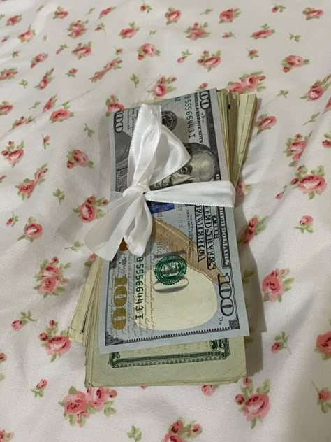 Coquette floral bed sheets money cash ribbon bow Money With Bow, Gift Giving Aesthetic, Coquette Vision Board, Pink Ribbon Aesthetic, Cash Aesthetic, Coquette Bed, Floral Bed Sheets, Money Coquette, Coquette Floral