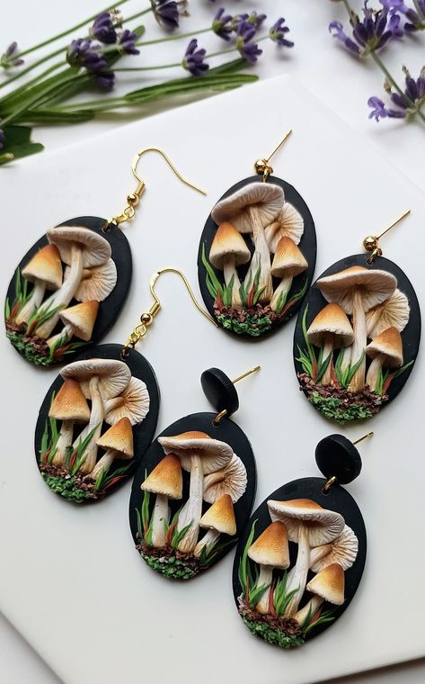 These handmade Magic Mushroom Earrings, crafted from polymer clay, are unique and dainty mushroom gifts perfect for cottage core enthusiasts, embodying whimsical jewelry. They make a charming gift for her and a nice gift for girlfriend. 🦋𝐋𝐄𝐍𝐆𝐓𝐇: 2 inches  🦋 𝐖𝐈𝐃𝐓𝐇: 1  inch  🦋 𝐌𝐀𝐓𝐄𝐑𝐈𝐀𝐋𝐒:🔹Polymer Clay 🔹Hypoallergenic nickel-free gold plated and silver plated attachment and parts🔹Attachments for sensitive ears are available upon request (please message the seller) 🦋𝐏𝐀𝐂? Mushroom Clay Earrings, Polymer Clay Mushroom Earrings, Clay Mushroom Earrings, Polymer Clay Mushrooms, Jewelry Mushroom, Mushroom Gifts, Cottage Core Jewelry, Clay Mushrooms, Polymer Clay Kunst