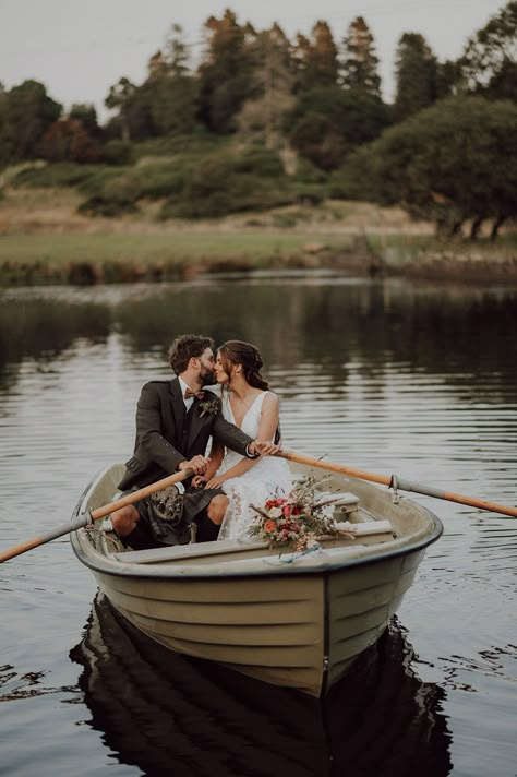 Bride and groom on a small row boat on the loch at Cardney Estate wedding venue Row Boat Wedding Photos, Cottage Wedding Photos, Wedding Photography Nature, Wedding Boat Pictures, Grainy Wedding Photography, Rustic Wedding Table Setting, Wedding Boat, Boat Photoshoot, Aurora Wedding