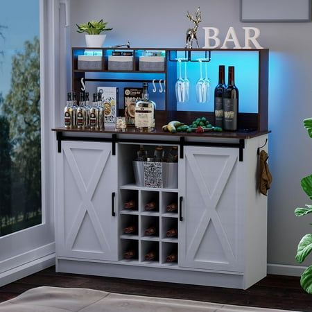 Feature: The coffee bar with a light strip and a control, manually select 20 colors and 22 modes 2 USB ports and a 6.5-foot power cord socket built into the desktop With 3 storage bags, 5 hooks, 2 rows of wine glass racks The central open storage shelf and 9 wine compartments provide ample storage space. The coffee bar cabinet has a side hook, which can be installed on the left or right according to your needs. Be used as kitchen hutch, buffet cabinet, sideboard, kitchen cabinet, coffee station Freestanding Bar Ideas, Home Bar Buffet, Coffee And Wine Bar Ideas Small Spaces, Beverage Station With Mini Fridge, Cabinet Bar Ideas, Coffee And Wine Bar Ideas, Mini Bar Ideas Small Spaces, Mini Bar At Home, Wine And Coffee Bar