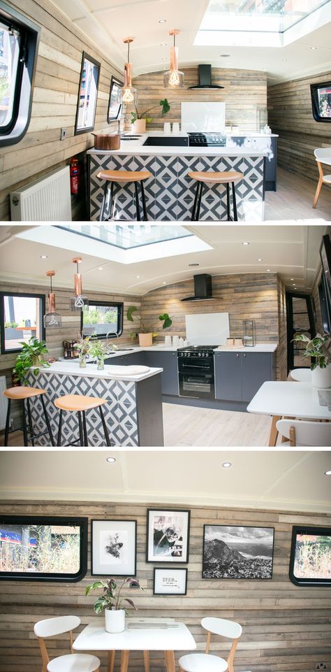 In the kitchen of a modern boathouse, an patterned tile accent designates the bar area of the kitchen, and on the adjacent wall, there's a small dining space for two. A skylight allows the natural light from above to filter through to the interior. #KitchenDesign #Boathouse Modern Boathouse, Barge Interior, Backsplash Accent, Narrowboat Interiors, Boat House Interior, Boat Interior Design, Reclaimed Wood Paneling, Houseboat Living, Dutch Barge