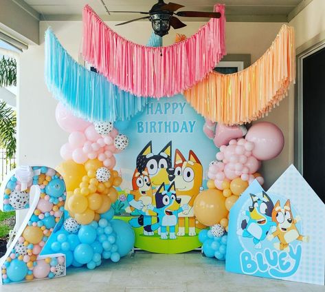 Whether you're still searching for unique birthday party themes, or have already decided that you're planning the *best ever* Bluey birthday party, this *freaking adorable* collection of Bluey party ideas will have you ridiculously excited and feeling totally inspired! From Bluey birthday cakes, cookies, food ideas, decor and so much more, these are the best Bluey birthday parties around! (One of the best toddler birthday themes for 2023). Bluey Birthday Garland, Bluey Themed Backdrop, Bluey Birthday 2 Girl, Blimey Birthday Party, Bluey Theme 1st Birthday, Bluey Backdrop Birthday, Blues Birthday Theme Girl, Bluey Halloween Birthday, Bluey Backdrop Ideas