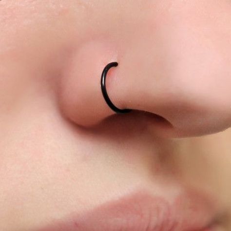 Jewelry | Black Nose Hoop 1 | Poshmark Black Nose Hoop Piercing, Black Hoop Nose Ring, Black Nose Rings, Nostril Piercing Jewelry Hoop, Black Nose Ring Aesthetic, Nose Piercing Styles, Cool Face Piercings, Nose Piercing Hoop Black, Cute Nose Rings Hoop