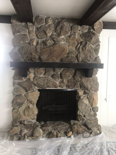 Stone Fireplace Wood Paneling, Over Grouted Stone Fireplace Before And After, Mirror Over Stone Fireplace, Diy Wood Fireplace Cover, Painting Faux Rock Fireplace, Dark Stone Fireplace Makeover, Big Stone Fireplace Living Room, How To Redo A Stone Fireplace, Moody Stone Fireplace