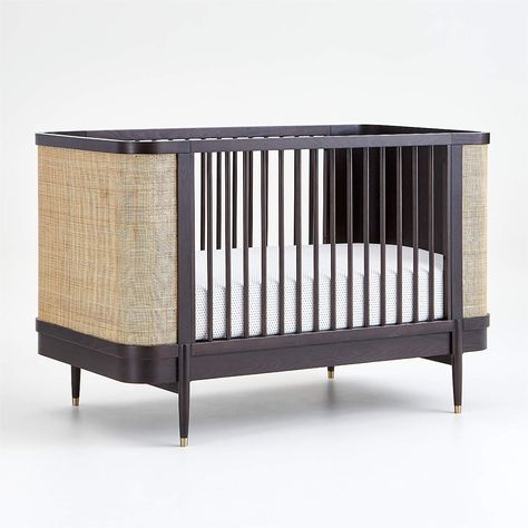 This is the perfect classic and sophisticated statement crib! The black contrasts the light caning and makes this crib stand out. See those gold capped feet? Someone please give me a nursery where I can use this crib! Head to the blog to see all my favorite rattan furniture and decor! Modern Baby Cribs, Baby Cribs Convertible, Modern Crib, Baby Bassinet, Nursery Crib, Baby Nursery Furniture, Baby Crib, Rattan Furniture, Baby Furniture