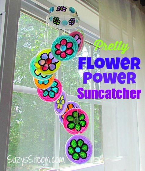 pringles lid crafts | made this suncatcher out of Pringles chips lids! Don’t judge, just ... Plastic Lids Craft, Plastic Lid Crafts, Pretty Suncatcher, Lid Crafts, Pringles Chips, Cap Craft, Diy Kid Activities, Flower Suncatcher, Recycled Crafts Kids