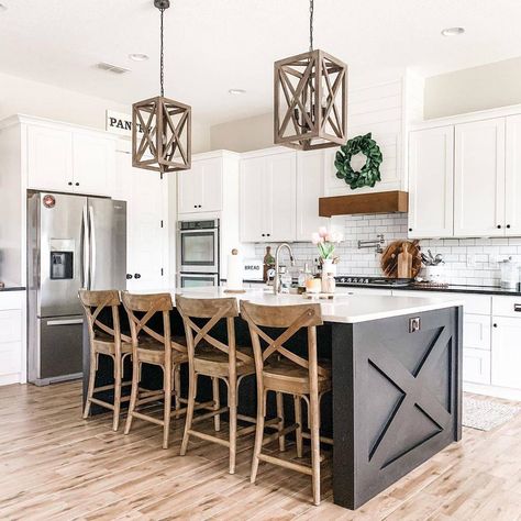 The traditional cross beam island, wooden accent bar stools, and rustic hanging light fixtures contribute to the traditional country feel of this kitchen. Image via FarmhouseHub on Pinterest. Kitchen Island Remodel Ideas, Rustic Farmhouse Kitchen Island, Kitchen Island Lighting Ideas, Farmhouse Kitchen Island Lighting, Island Lighting Ideas, Pendant Designs, Farmhouse Kitchen Island, Farmhouse Kitchen Design, Rustic Farmhouse Kitchen