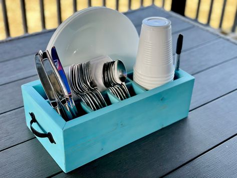 "Stop your search! You've found the perfect picnic caddy! This utensil caddy holds every essential item for your bbq, picnic, party, or dinner in a small, compact footprint! This will impress your guests and last for many, many years of entertaining. ✔Fork, Spoon and Knife Slots ✔Napkin Holder ✔Full Size Plate Compartment ✔16oz Solo Cup Holder with Sharpie Marker Hole At a full 4.5\" tall, there is plenty of depth to easily hold all of your silverware, napkins, plates and cups upright. You can c Picnic Caddy, Solo Cup Holder, Caddy Diy, Silverware Caddy, Plates And Cups, Utensil Caddy, Bbq Picnic, Solo Cup, Wood Utensils