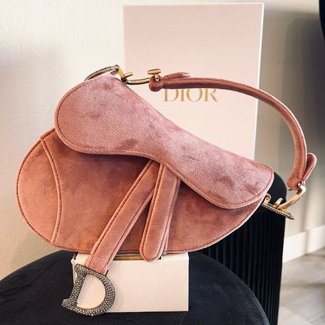 This Christian Dior Saddle Handbag Velvet With Crystals Mini, Crafted From Pink Velvet, Features A Top Handle Adorned With Metal 'Cd' Hardware And Aged Gold-Tone Hardware. Its Fold Over Top Opens To A Pink Suede Interior With Zip Pocket. Perfect Never Worn Condition Accessories: Dust Bag, Box, Auth Card Measurements: Handle Drop 4.5", Height 6", Width 7.5", Depth 2" Designer: Christian Dior Model: Saddle Handbag Velvet With Crystals Mini Pink Suede Bag, Dior Saddle Vintage, Dior Mini Saddle Bag, Saddle Handbag, Mini Saddle Bag, Card Measurements, Saddle Handbags, Dior Model, Quick Weave Hairstyles