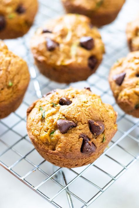 These pumpkin zucchini muffins are moist and full of flavor. Let’s bridge the gap between summer and fall with these pumpkin zucchini muffins! Chocolate Pumpkin Zucchini Muffins, Pumpkin Zucchini Chocolate Chip Muffins, Zucchini And Pumpkin Recipes, Healthy Pumpkin Zucchini Muffins, Zucchini Pumpkin Muffins, Grain Free Pumpkin Muffins, Pumpkin Zucchini Muffins, Zucchini Pommes, Fall Yummies