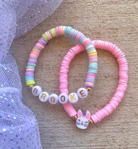 "These fun bracelets are stylish and chic for young girls.  Perfect easter basket gift, gift to fill Easter eggs for egg hunt, birthday gifts, friendship bracelets, the list can go on.  Bracelet listing includes ONE custom name bracelet ( can also have it say a word or phrase such as best friends, besties, etc) with the option of a bunny, princess, unicorn gummy bear or heart charm.  Pair with our solid stacking bracelets to make a cute custom stack!  PRODUCT DETAILS: - All letters are upper case - Use \"personalization\" box at checkout to list your name/phrase for bracelets - Bracelets are made with stretchy quality jewelry elastic  - All orders are FINAL SALE as they are custom orders. Please double check spelling and size." Bunny Princess, Jewelry Kids, Kids Bracelet, Personalized Easter Gifts, Kids Easter Basket, Fun Bracelet, Basket Gift, Easter Gifts For Kids, Bead Charms Diy